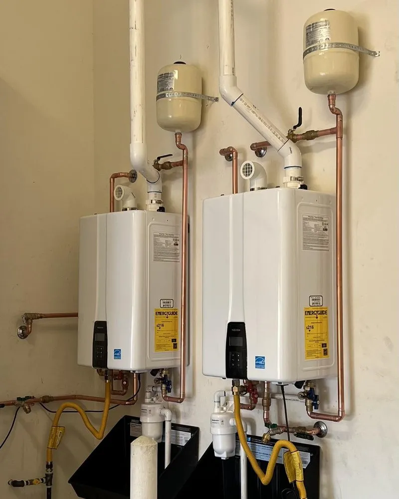 Dual Navien tankless water heaters installed side by side by Lawson Family Plumbing
