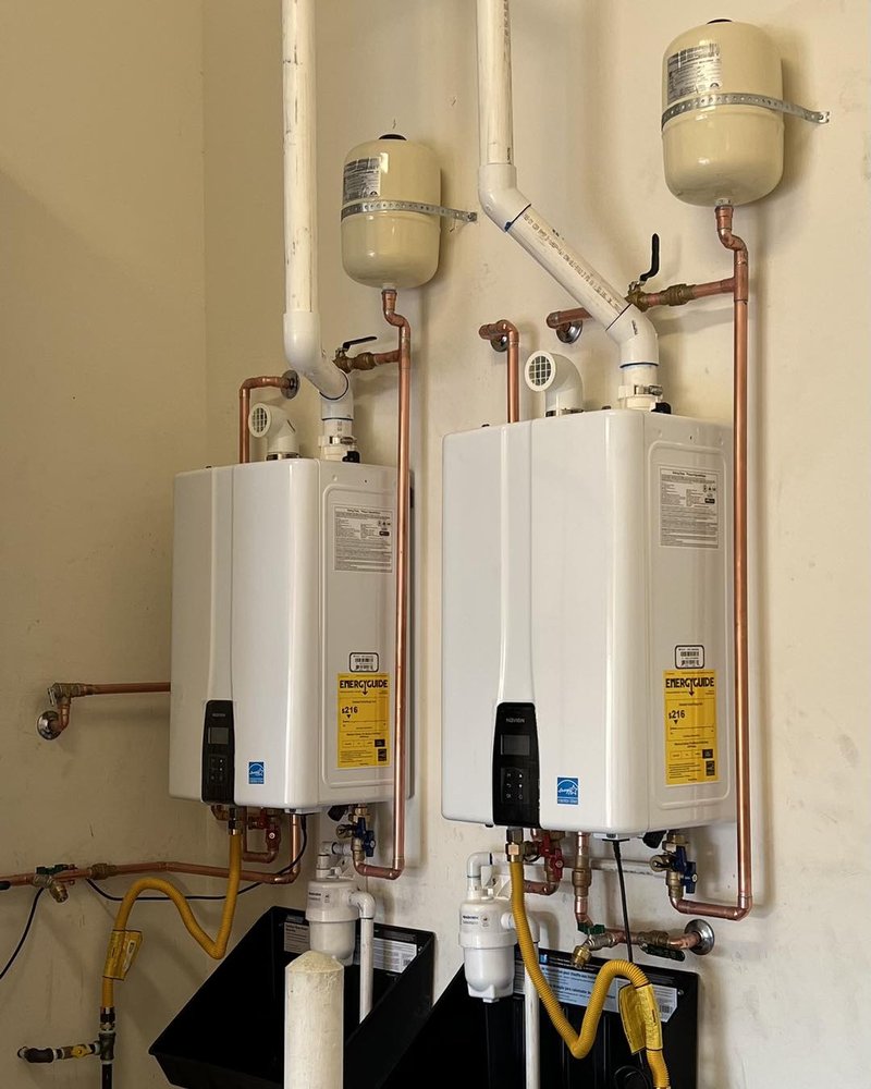 Dual Navien tankless water heaters installed side by side by Lawson Family Plumbing